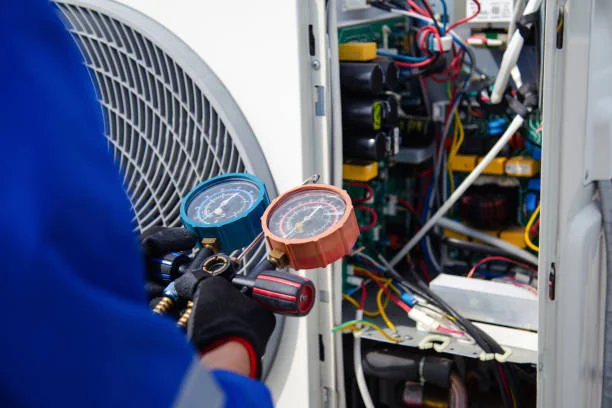 HVAC technician reading refrigerant gauges during system diagnostics